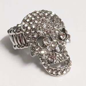 Rhinestone-encrusted skull ring with an adjustable band